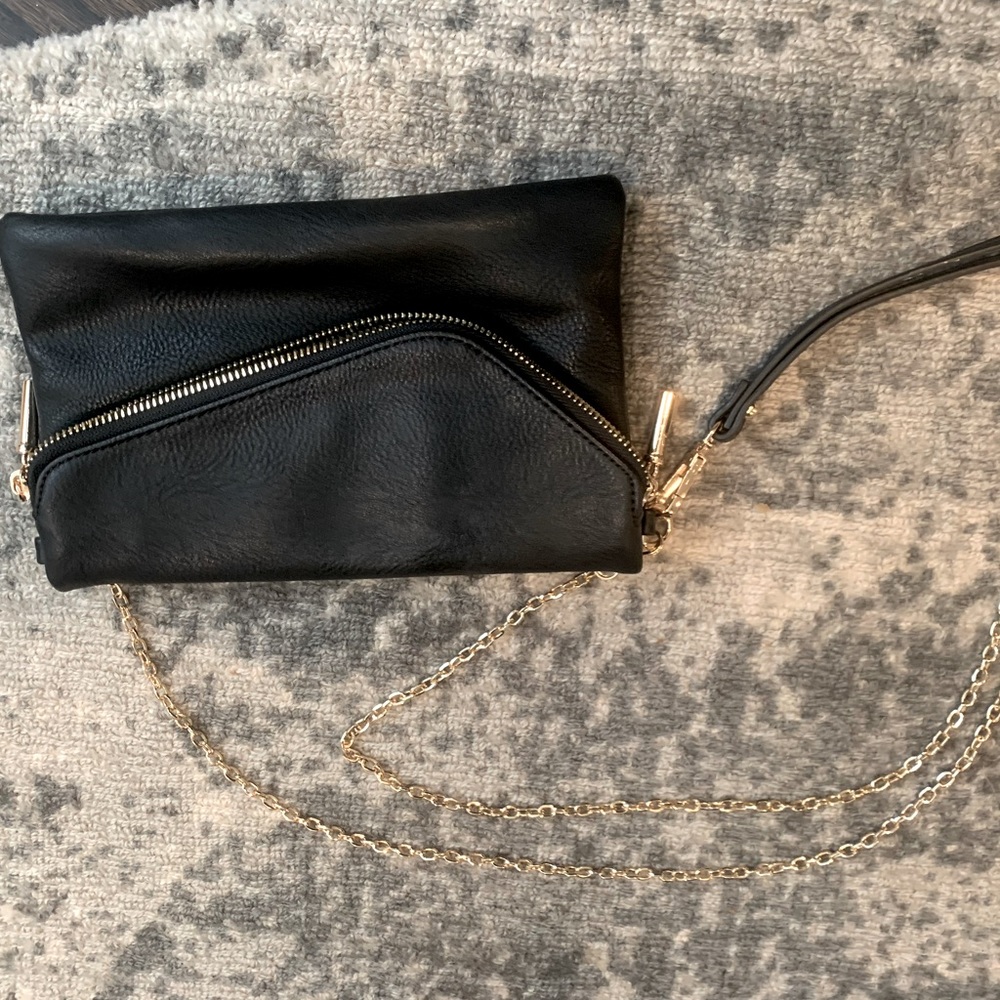 Small faux leather clutch. Brand New